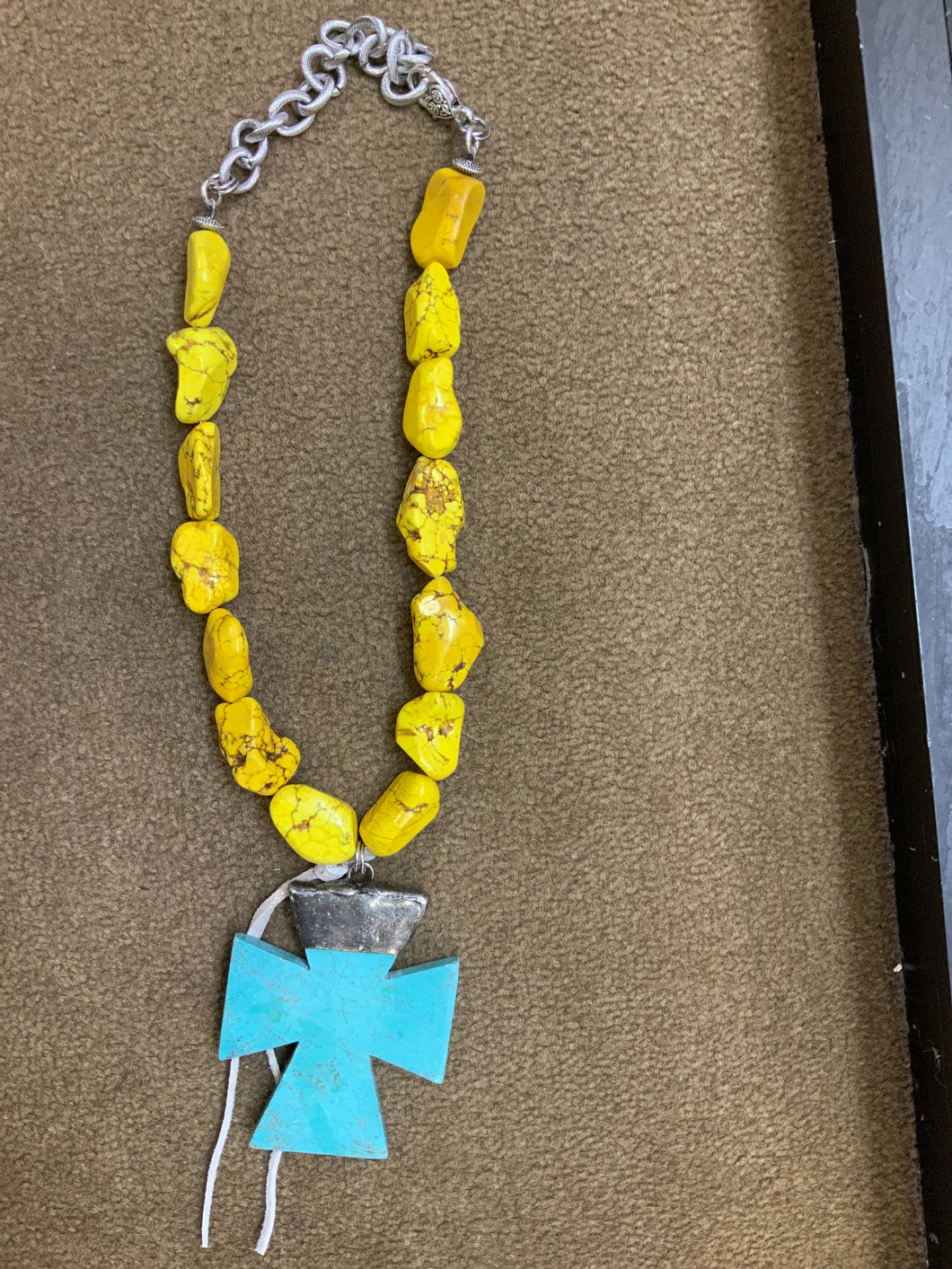 Yellow and turquoise cross